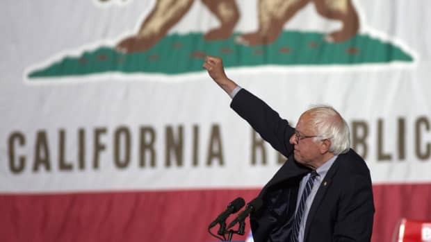 Democratic presidential candidate Senator Bernie Sanders raises his fist at his California primary election night rally on June 7, 2016 in Santa Monica