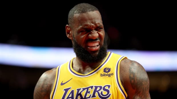 LeBron James of the Los Angeles Lakers reacts during the second quarter against the Portland Trail Blazers at Moda Center on November 17, 2023 in Portland, Oregon.
