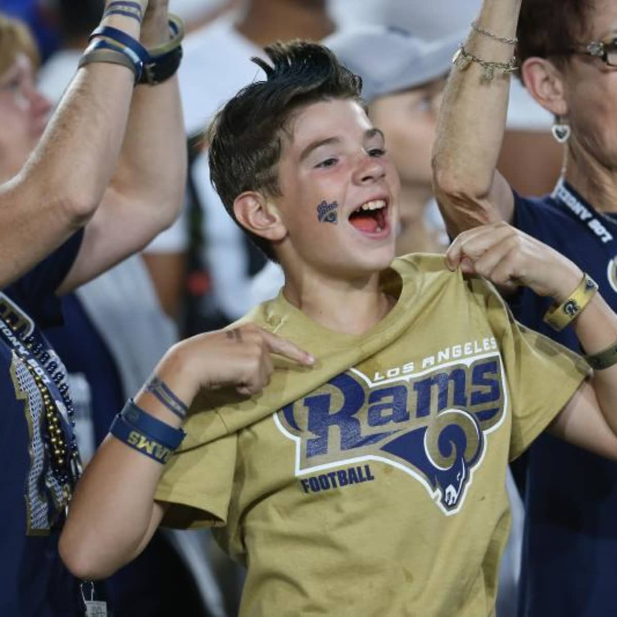 Los Angeles Rams fans cheer for the team during an NFL football