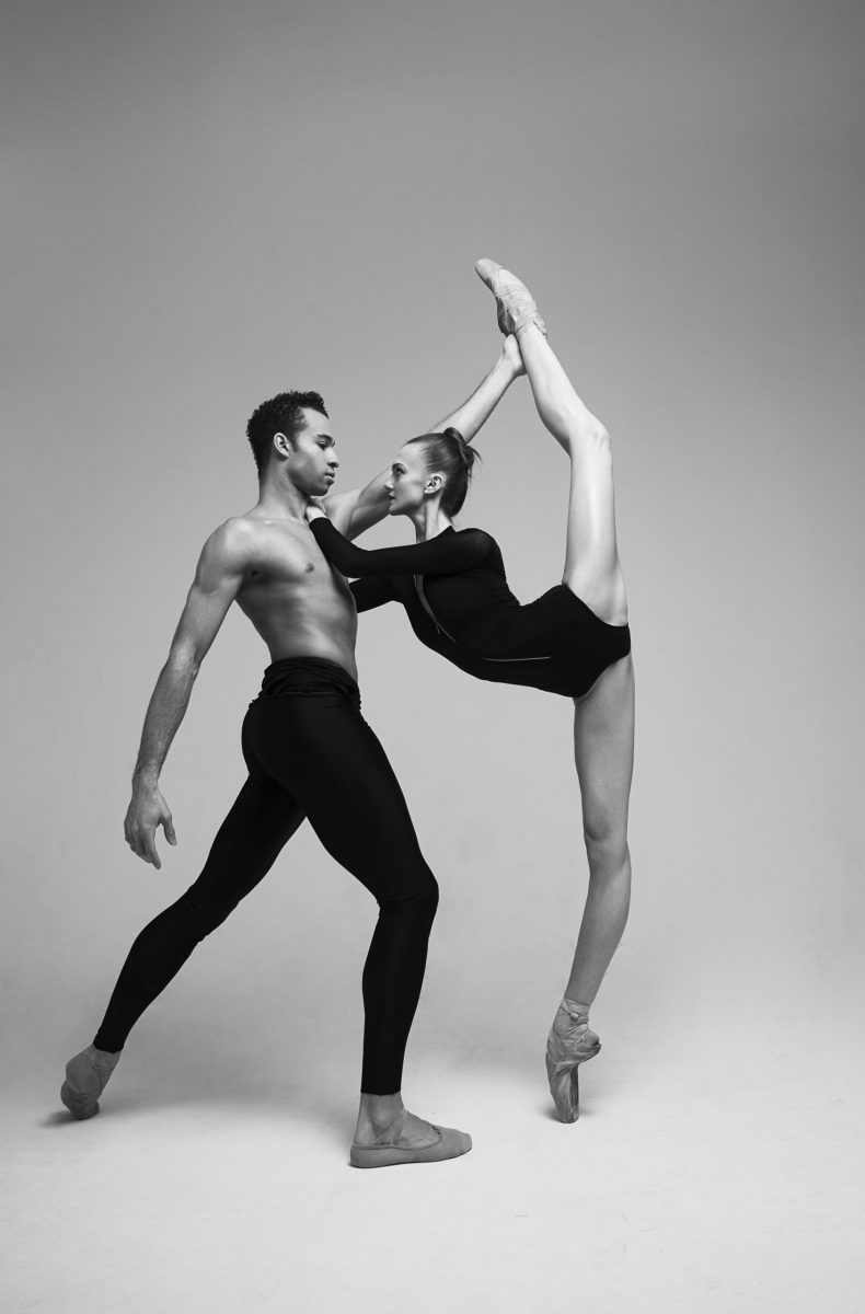 Young man and woman, ballet dancers performing isolated over dark grey  studio background. Beautiful tender couple Stock Photo | Adobe Stock
