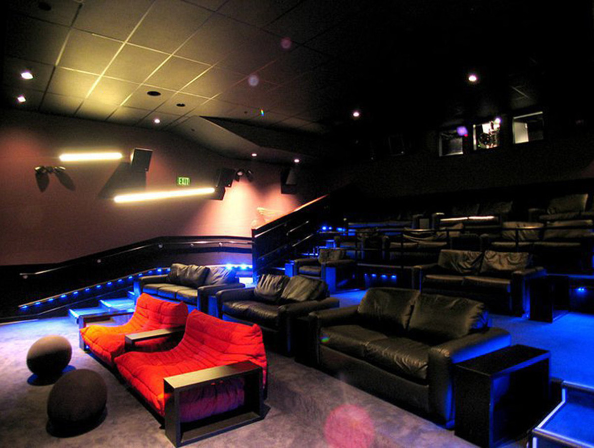 Movie theater with couches near outlet me